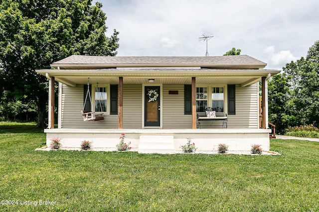 view of front of home with a front yard and a porch