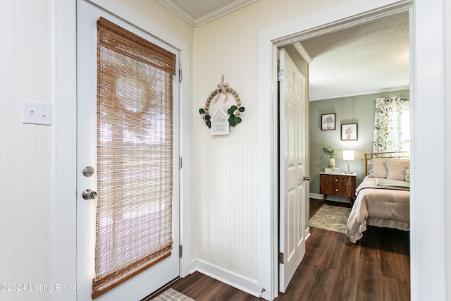 interior space featuring crown molding and dark hardwood / wood-style floors