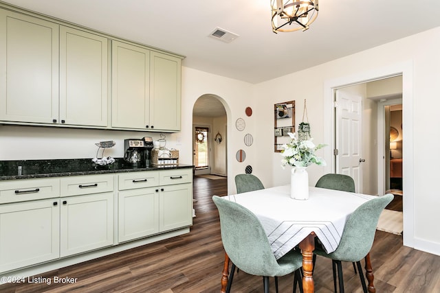 dining space with dark hardwood / wood-style floors