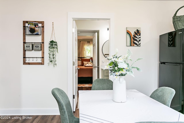 dining area featuring dark hardwood / wood-style flooring