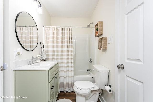 full bathroom with shower / tub combo, vanity, hardwood / wood-style flooring, and toilet