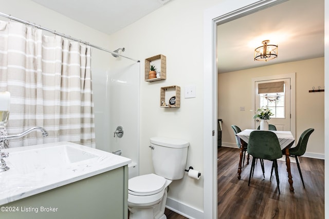 bathroom with vanity, wood-type flooring, and toilet