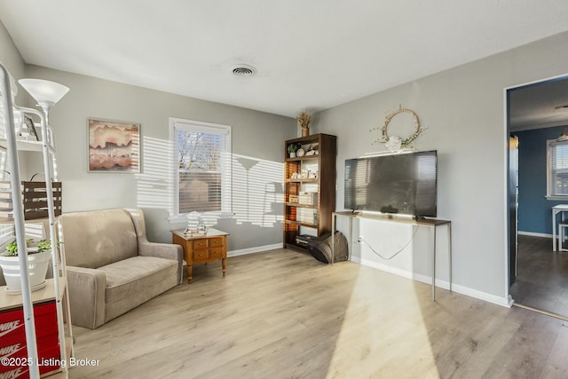 sitting room featuring light wood-type flooring