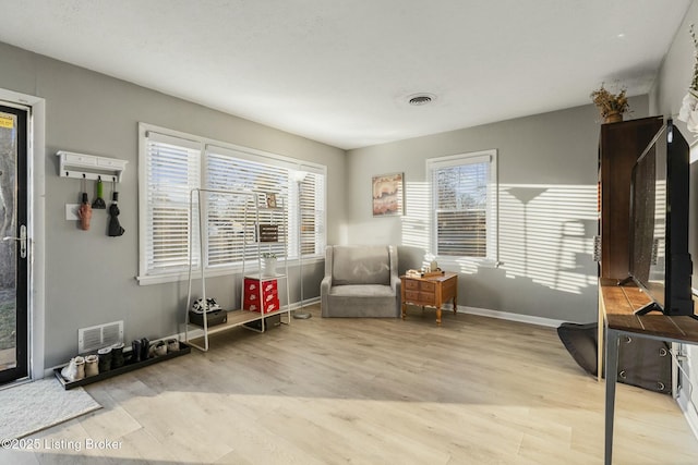 sitting room with light wood-type flooring