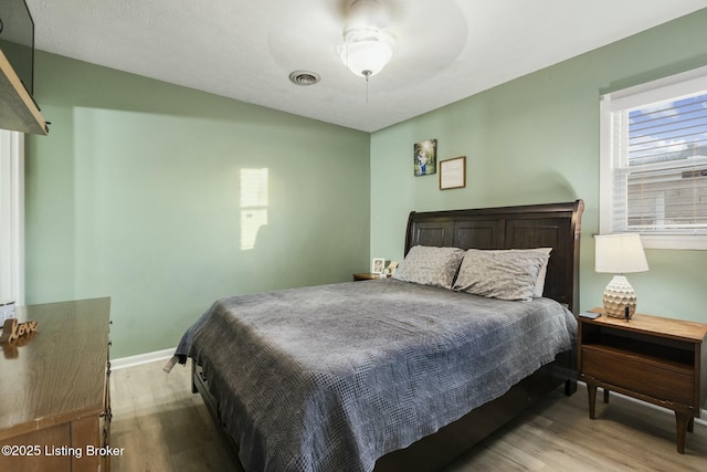 bedroom with wood-type flooring