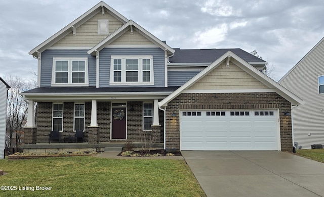 craftsman house featuring a garage, covered porch, and a front lawn