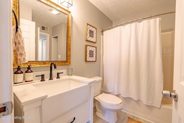 full bathroom with vanity, shower / tub combo with curtain, a textured ceiling, and toilet