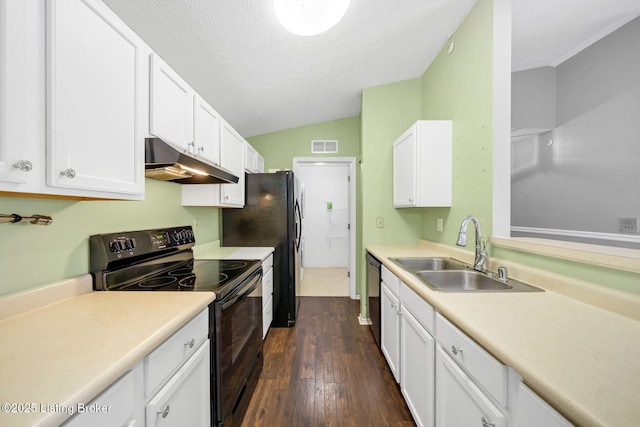 kitchen with lofted ceiling, sink, white cabinetry, black / electric stove, and stainless steel dishwasher