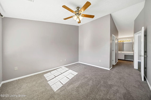 unfurnished bedroom featuring ceiling fan and dark carpet