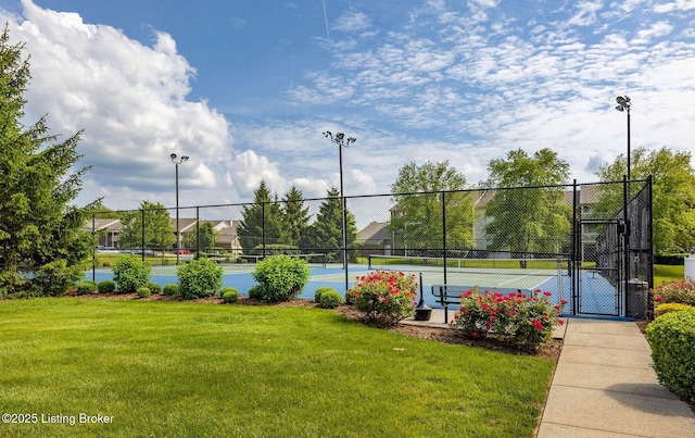 view of sport court featuring a yard