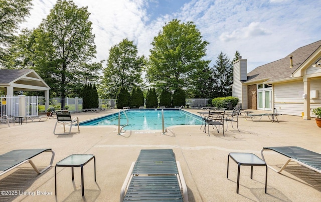 view of swimming pool with a patio area