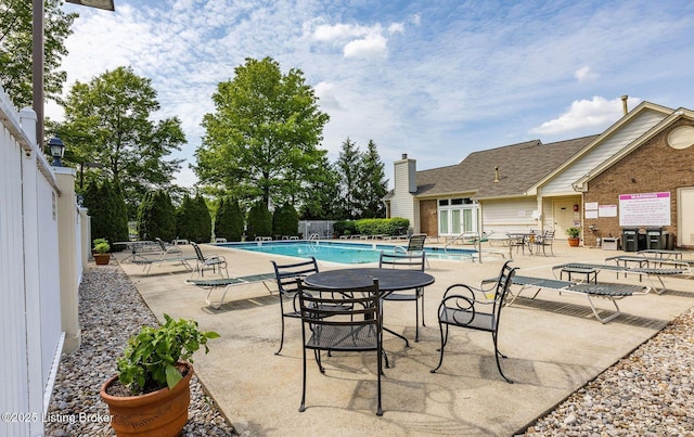 view of swimming pool with a patio