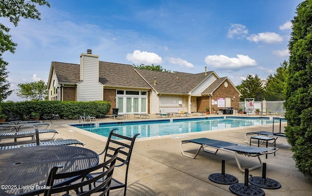 view of swimming pool with a patio