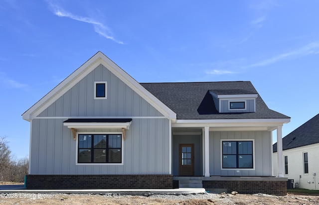 1603 Meremont Ridge Rd, Louisville, KY 40245 - modern inspired farmhouse with board and batten siding, brick siding, covered porch, and a shingled roof