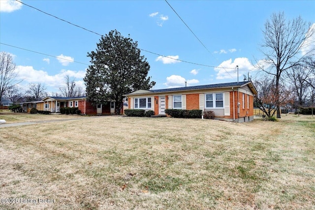 single story home with a front lawn