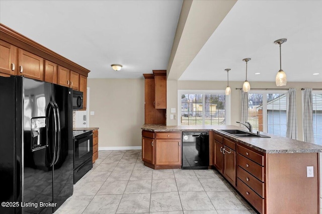 kitchen with pendant lighting, sink, light tile patterned floors, black appliances, and kitchen peninsula