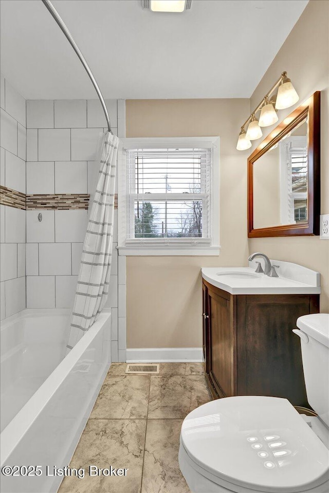 full bathroom with vanity, toilet, and shower / bath combo