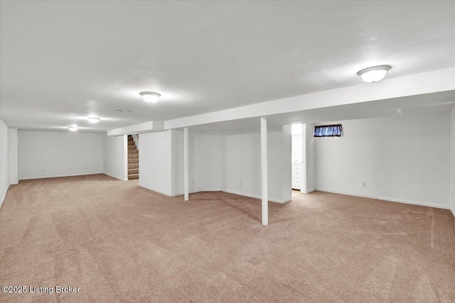 basement with light colored carpet