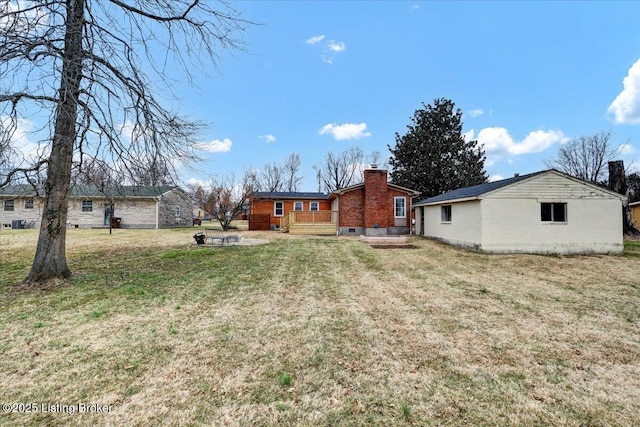 view of yard featuring a wooden deck