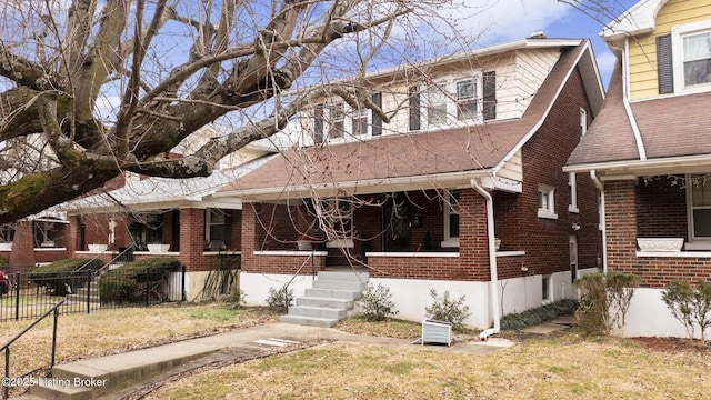 view of front of property with a front yard and covered porch