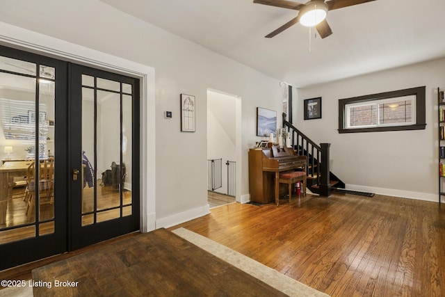 entrance foyer featuring french doors, ceiling fan, and hardwood / wood-style floors