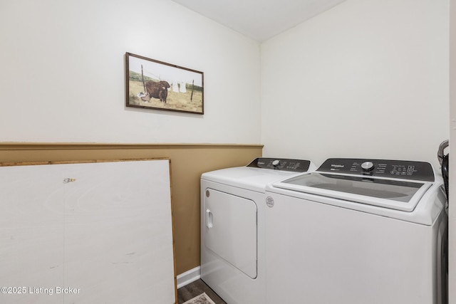 clothes washing area featuring independent washer and dryer