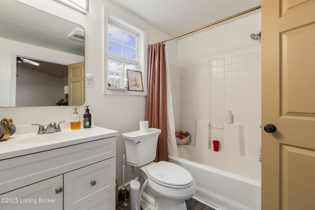 full bathroom featuring shower / bathtub combination with curtain, vanity, and toilet