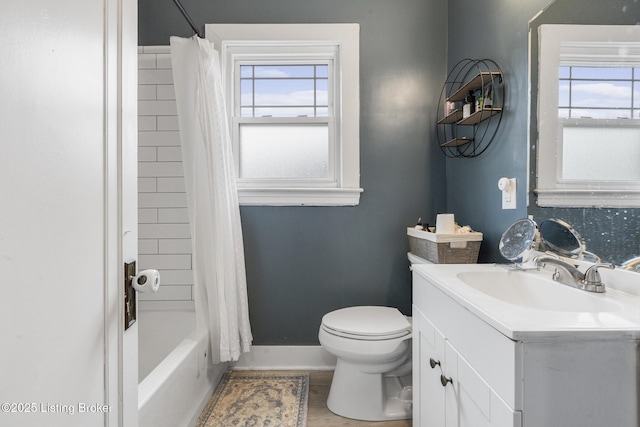 full bathroom with vanity, shower / bath combination with curtain, and toilet