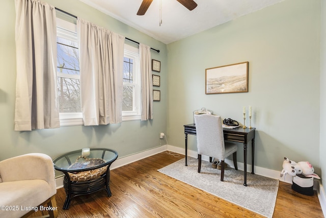 office with hardwood / wood-style flooring and ceiling fan