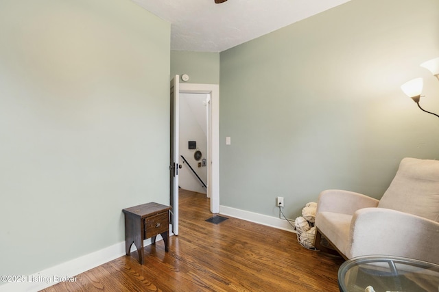 living area featuring dark wood-type flooring