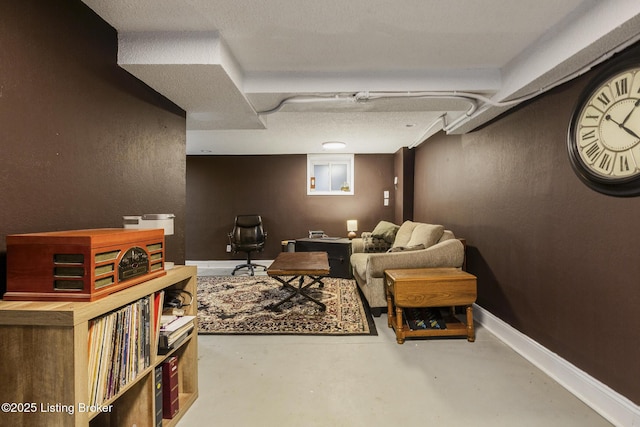 living area featuring concrete floors