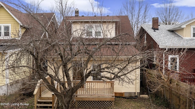 view of home's exterior featuring a deck