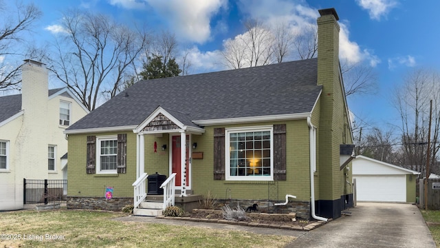 view of front facade featuring a garage and an outdoor structure