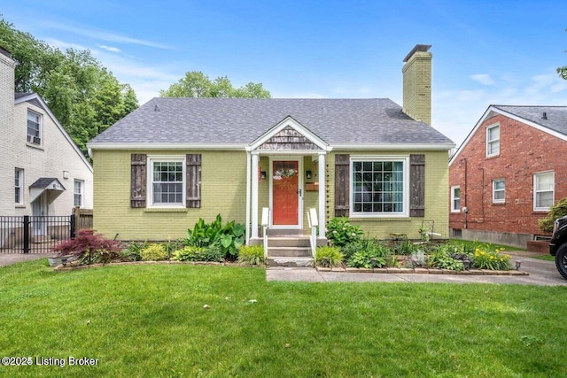 bungalow-style home featuring a front yard