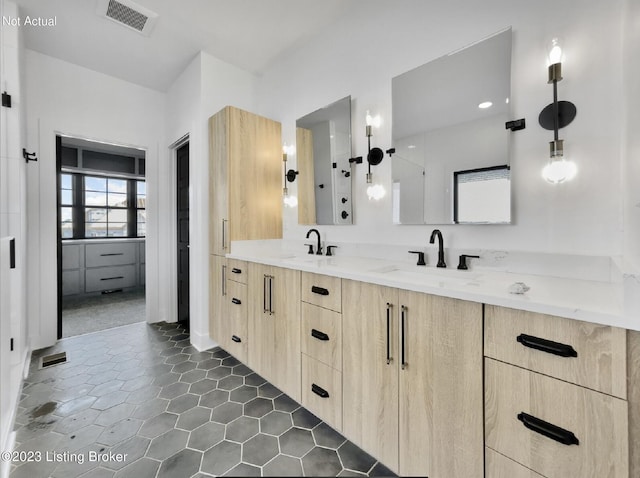 bathroom with vanity and tile patterned floors