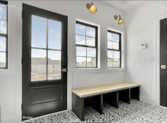 mudroom featuring light tile patterned flooring and plenty of natural light