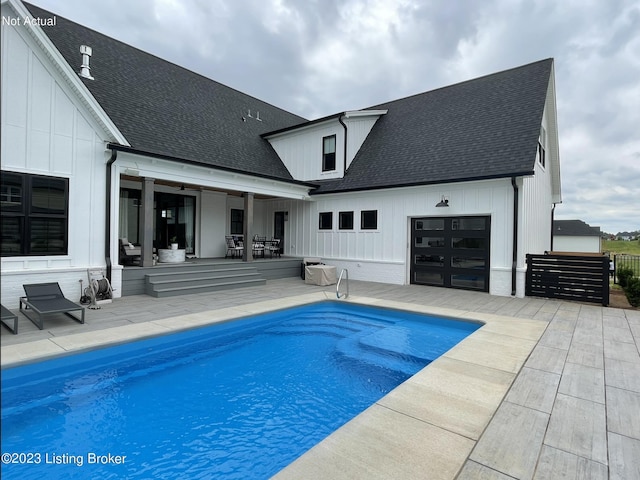 view of swimming pool with a patio area