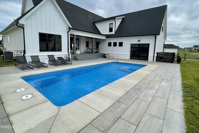 view of swimming pool featuring a patio area