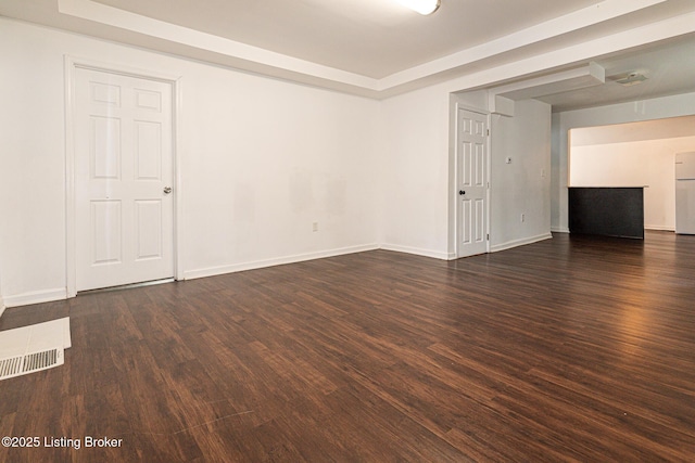 spare room with dark hardwood / wood-style floors