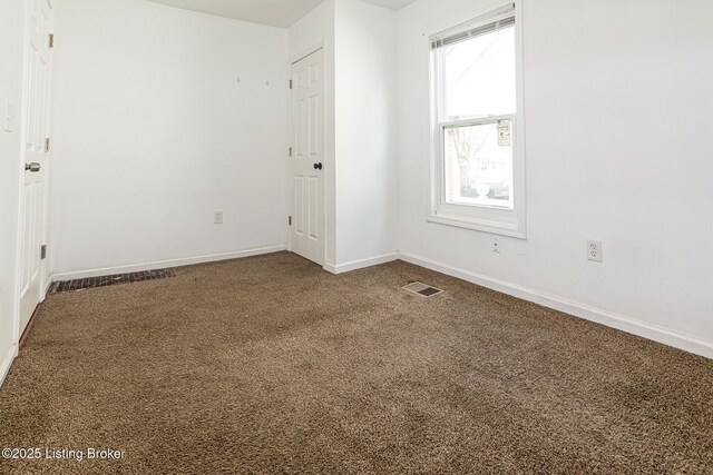 spare room featuring carpet