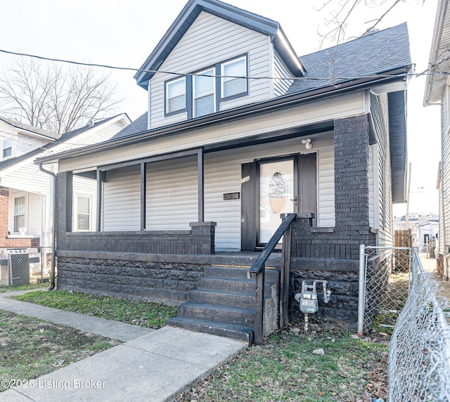 view of front of house with central AC unit and covered porch