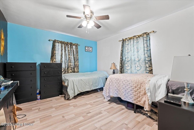 bedroom featuring light wood-type flooring and ceiling fan