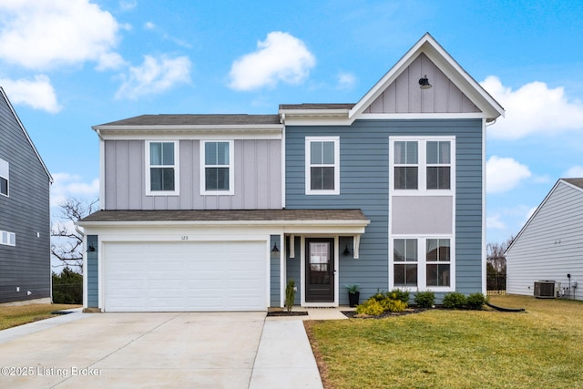 view of front of property with a garage, a front yard, and central air condition unit