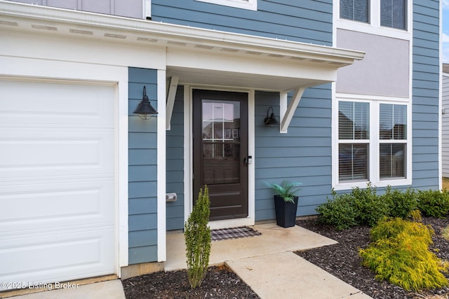 entrance to property featuring a garage