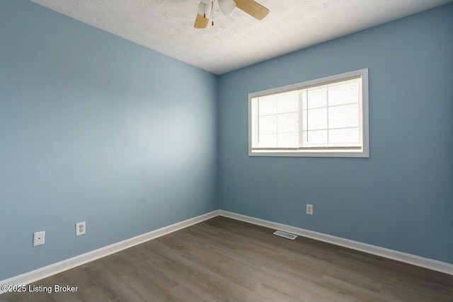 141-147 Darby Woods Ct, Radcliff, KY 40160 - empty room with ceiling fan, wood-type flooring, and a textured ceiling