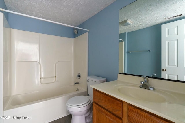 141-147 Darby Woods Ct, Radcliff, KY 40160 - full bathroom with vanity, shower / bathtub combination, a textured ceiling, and toilet