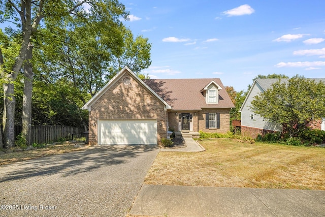 view of front of home featuring a garage and a front yard