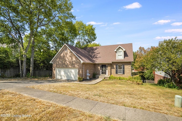 view of front of house with a garage and a front lawn