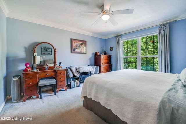 bedroom with crown molding, light colored carpet, a textured ceiling, and ceiling fan