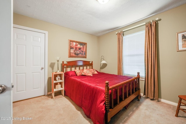 carpeted bedroom with a textured ceiling